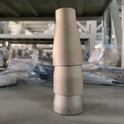 China Concrete reducer SMLS DN 200x100 CuNi9010 DIN 86089 3x2,5 mm Butt welding fittings Te koop