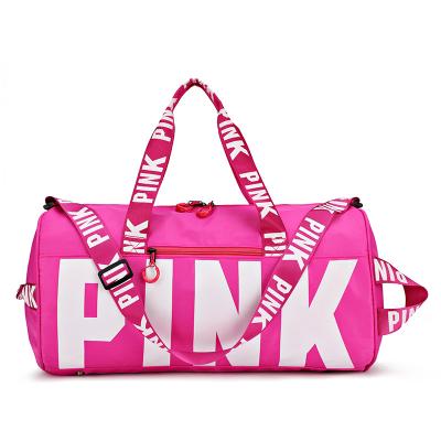 China Customized pink logo gym women large capacity duffel bags durable waterproof sports travel bag for sale