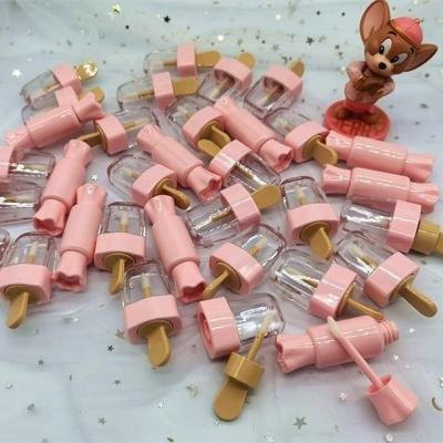 China Manufacturers Low Price 10ml Plastic Direct Ice Cream Popsicle Form Glair Lip Gloss Tube Labial Eyelash Tool for sale