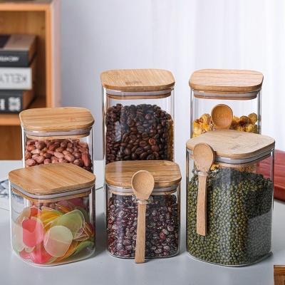 China Wholesale High Borosilicate Glass Candy Storage Storage Canister Kitchen Freshness Canister Food Airtight Glass Storage Jar With Lid And Bamboo Spoon for sale