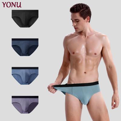 China Custom Logo Spandex /Modal Sports Breathable Sexy Seamless Mid-waist Underwear Breathable Briefs For Men for sale