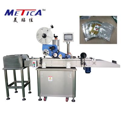 China Automatic High Speed ​​Food Plastic Bags Flat Sticker Paging Labeling Machine With Feeder for sale