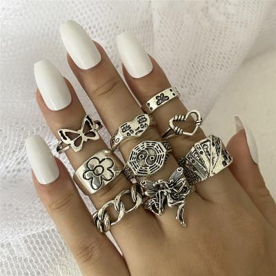 China Retro High Quality Scream Face Alloy Chain Ring 9 Pieces Set Hollow Love Daisy Silver Ring Set for sale