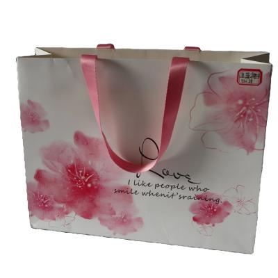 China Recyclable Cheap Famous Brand Gift Cotton Handle Shopping Custom Printed Paper Bag With Your Own Logo for sale