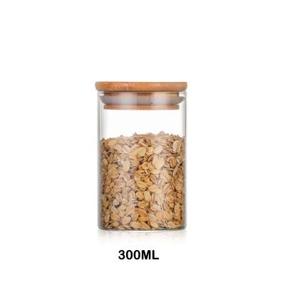 China Clear Glass Bamboo Airtight Storage Container Freshness Preservation Food Jar Candy Jar for sale