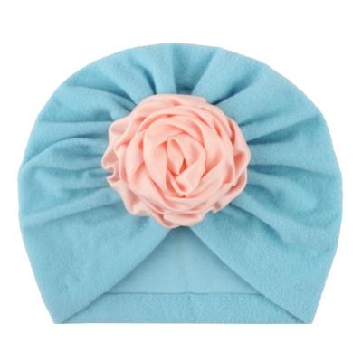 China 2019 popular image style children's hat winter baby ribbon flower baby winter turban hat for sale