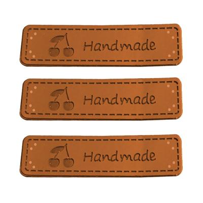 China Viable Wholesale Custom Your Brand LOGO Clothing Folded Leather Label Tag For Garment for sale