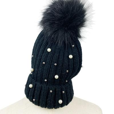 China JOINT Classic Custom Design Solid Color Women's Knit Winter Ride Up Beanie Hat With Pearl And Big Fur Pompom for sale