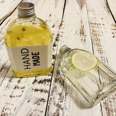 China Hot Sale Beverage Flask Portable Glass Bottle For Coffee Wine Sauce Spirits Flat Glass Bottle With Plastic Cap for sale