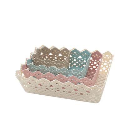 China Sustainable woven hollow plastic cosmetics household storage basket magazine storage basket like storage rattan for sale