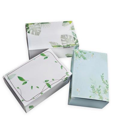 China Handmade foldable ivory paper box with flower pattern for eye gel and facial goods for sale