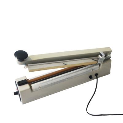 China Cheap And High Quality Heat Sealer Hand Impulse Heating Wrapping Machine With Side Cutter for sale