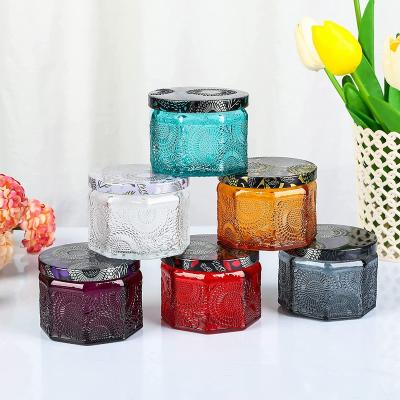 China Fashionable Bulk Octagonal Candle Cup Glass Embossed Candlestick Cup Color Scented Candle Jar With Lid Decoration Home Christmas for sale