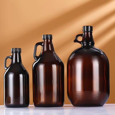 China Fashionable Wholesale 32oz 64oz Amber Glass Beer Growler California Wine Bottle With Cork Or Foil Cap for sale