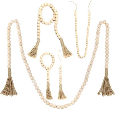 China Eco-Friendly Hot Sale Rustic Natural Tassels Amazonian Bead Wood Garland for Home and Sprig Farmhouse Decor for sale