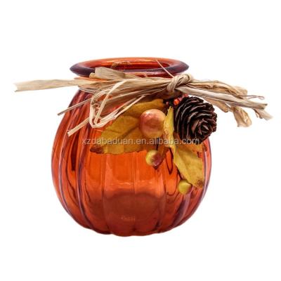 China Home Decoration Pumpkin Modeling Orange Glass Candle Holder With Dried Flower Decoration for sale