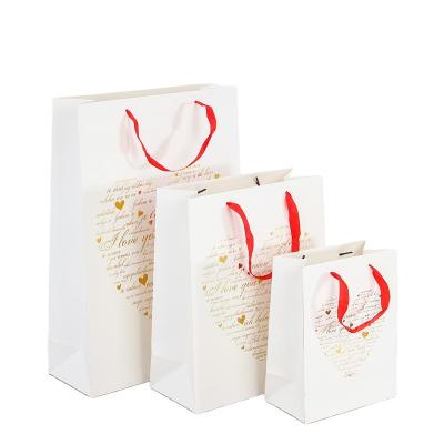 China Recyclable High Quality Recyclable Paper Bags With Your Own Logo Luxury Gift Bags Gift Suitcase for sale