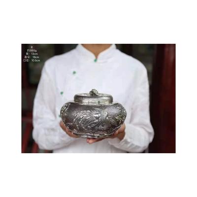 China Retro Sustainable High End 999 Silver Material With Patterned Tea Canister Bainiao Chaofeng Tea Can for sale