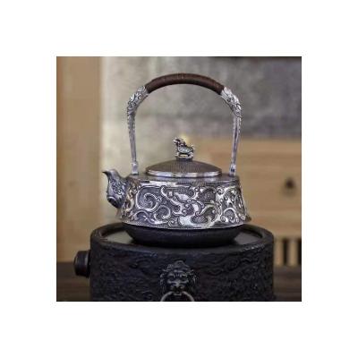 China Large Capacity Silver Grass Dragon Relief Kettle Viable Ancient Chinese Teapot Kettle for sale