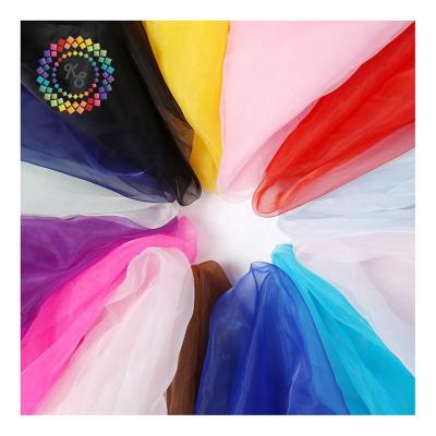 China 100% polyester wedding decoration solid color organza anti-static fabric for making dress for sale