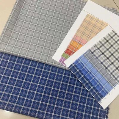 China Viable in stock TC wholesale gingham fabric for shirts dress woven plaid fabric cotton yarn-dyed checkered polyester for sale