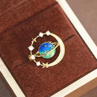 China Temperament Brass Sensitive Blue Female High-Grade Niche Pin High Grade Planet Oil Drop Series Galaxy Gold Plated Brooch Pin for sale