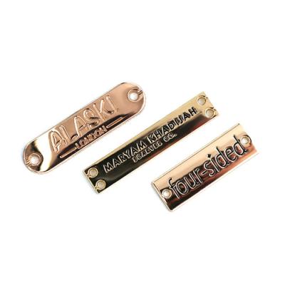 China Custom Fashion Eco-friendly Gold Metal Clothing Labels , Small Rectangle Metal Name Tag For Bikini / Swimwear for sale