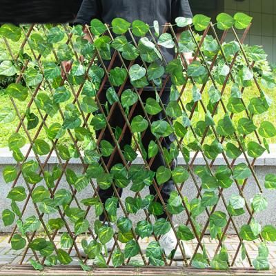 China Minimalist 0.7m Can Stretch Wholesale Green Ivy Trellis Artificial Garden Plant Fence for sale