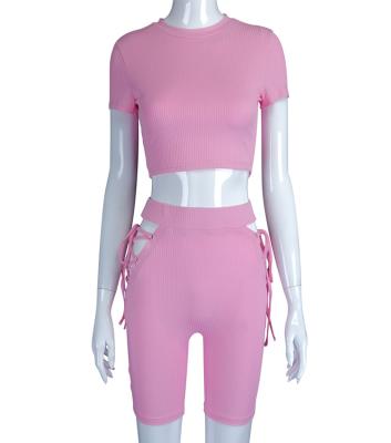 China 2021 Breathable Fashionable Crop Top O-Neck Women Short Sleeve Suit Hollow Bandage 2 Piece Set Women Shorts for sale