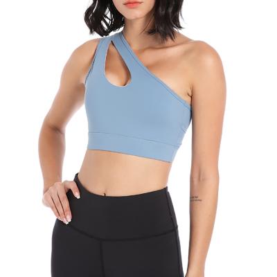 China QUICK DRY Custom Logo One Shoulder Strap Mid Support Yoga Cut Out Sports Bra Gym Yoga Top For Ladies for sale