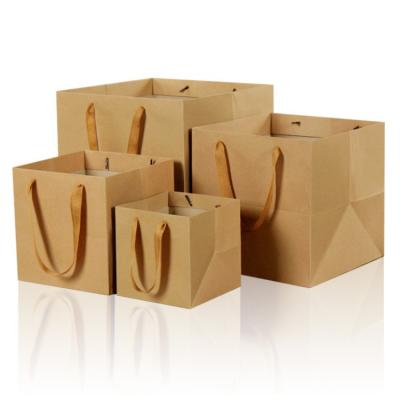 China Recyclable Plain Paper Bag Luxury Wholesale Multiple Sizes White Kraft Cardboard Paper Shopping Bags for sale