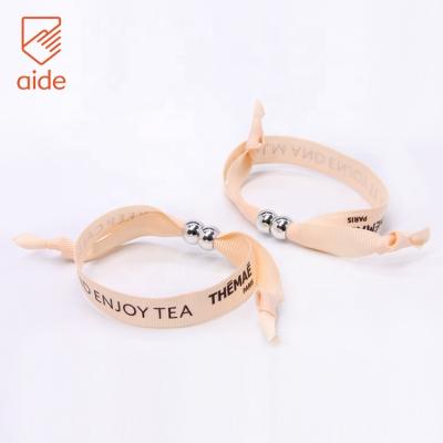 China Disposable Cheap Customized Fashion Branded Party Woven Fabric Adjustable Music Festival Wristband for sale