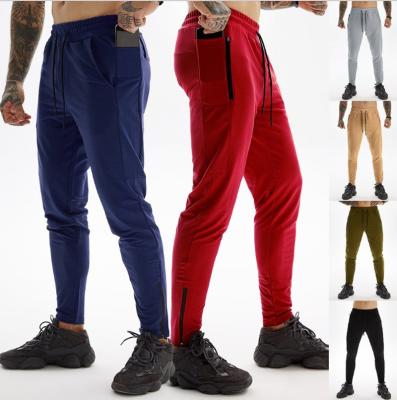 China Anti-Wrinkle Sports Elastic Waist Solid Color Fitness Jogging Track Casual Men's Pants for sale