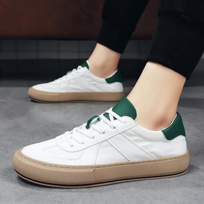 China Cushioning comfort sneakers men's spring shoes casual vulcanized sneakers outfit new leather white shoes 2022 shoes man for sale