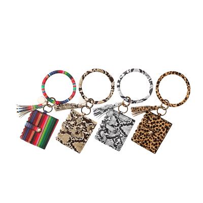 China Eco-friendly Snakeskin Bracelet Key Ring Wallet Women Serape Leopard Tassel Bracelet Key Chain ID Card Holder for sale