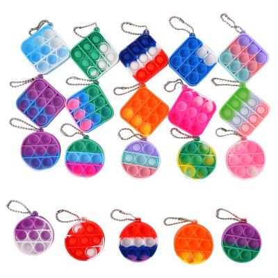 China Cheap Promotion Gift Mini Push Pop It Fidget PVC Key Chain Relieve Silicone Key Ring Wholesale for sale