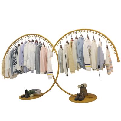 China Accept eco-friendly customized new store shopping and hang clothes display racks, high-end art clothing arc c-shaped display racks iron for sale