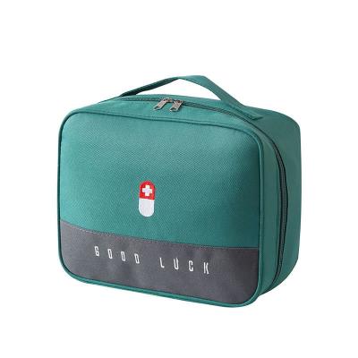 China New Sustainable Oxford Cloth Portable Travel Storage Bag Household Medicine Classification First Aid Kit for sale