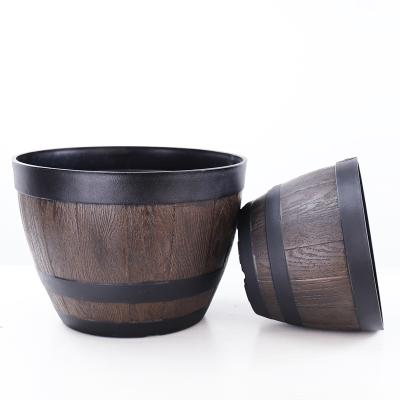 China Resin Imitation Wine Bucket Universal Vintage Distressed Sago Cycas Resin Planting Flowers And Trees Creative Plastic Green for sale