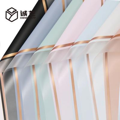 China Waterproof Style Attractive Flower Waterproof Wrapping Paper With Gold Edge Hot Stamping Printing Wrapping Paper for sale