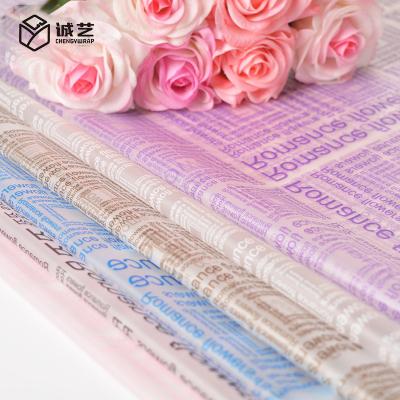 China Quality waterproof super waterproof translucent film wrapping paper floral English alphabet printing gift wrapping materials for sale