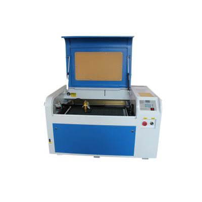 China High Grade 4060 Laser Baby Pacifier Co2 Engraving Machine Full-enclosed Laser Engraving And Cutting Machine for sale