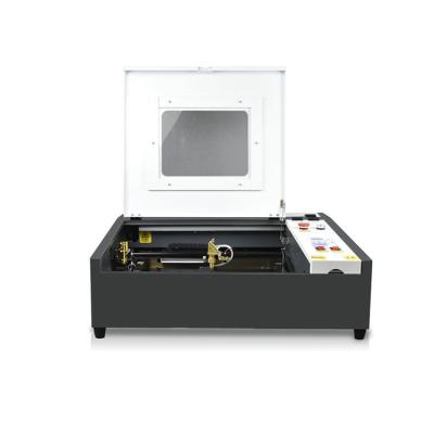 China Full-enclosed 4040 Mini Fiber Laser Engraving Machine Top Quality Acrylic Jewelry Engraving Machine for sale