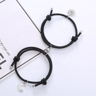 China FASHIONABLE Couples Best Friend Attract Bracelet Men Women Rope Weaving Magnet To Attract Sun Background Moon Bracelet Love Pending Jewelry for sale