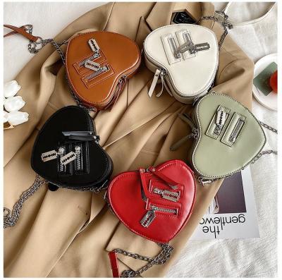 China New high quality PU love heart gold leather fashionable shape leather ladies chain purses bags women handbags ladies for sale