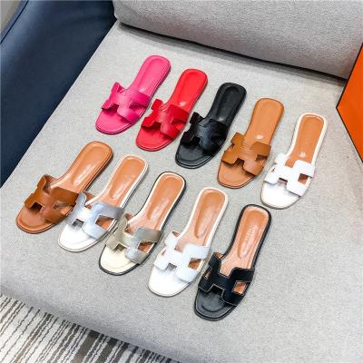 China Leather Sandal Woman Designer Sandals Flat Slippers Famous Brands Women's Casual Shoes Lit Summer for sale