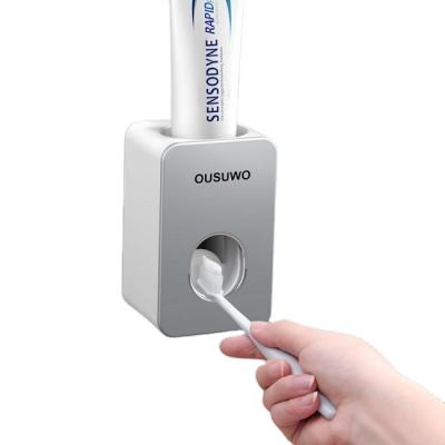 China Viable Wholesale Wall Mounted Toothpaste Squeezer Bathroom Display Automatic Toothpaste Dispenser for sale