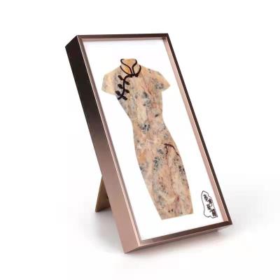 China Modern creative pattern cabinet living room office decorations of China marble cheongsam new metal photo frame TV decoration for sale