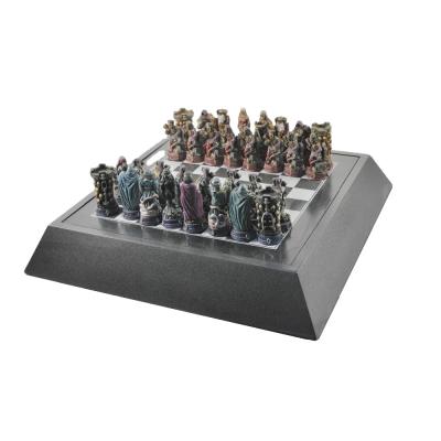 China Resin theme chess set with custom antique chess pieces and wooden case for sale