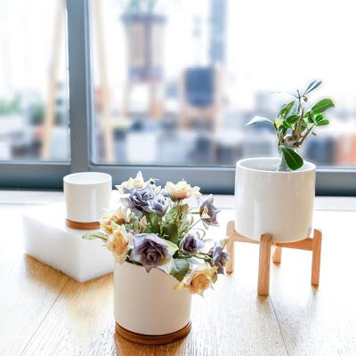 China Factory Wholesale Nordic Europe Ceramic Flower Pot Indoor Cylinder Porcelain Crafts Garden Pots With Tray Bamboo Rack for sale